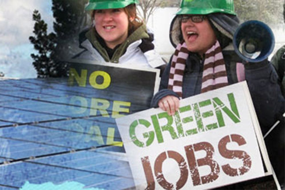 Two excited people holding a megaphone and protest signs for "Green Jobs" and "No More Coal".